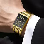 Load image into Gallery viewer, Side view of men's rectangular black gold watch with gold-tone stainless steel bracelet