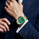 Load image into Gallery viewer, Side view of men's diver-inspired night glow watch with stainless steel bracelet and luminous markers