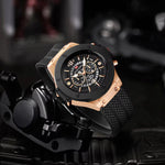 Load image into Gallery viewer, Close-up of 46mm men's open heart skeleton watch with rose gold accents on black silicone strap