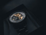 Load image into Gallery viewer, Skeletonised luxury sports watch on dark background