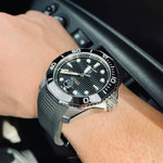Load image into Gallery viewer, Black sports watch worn on the wrist