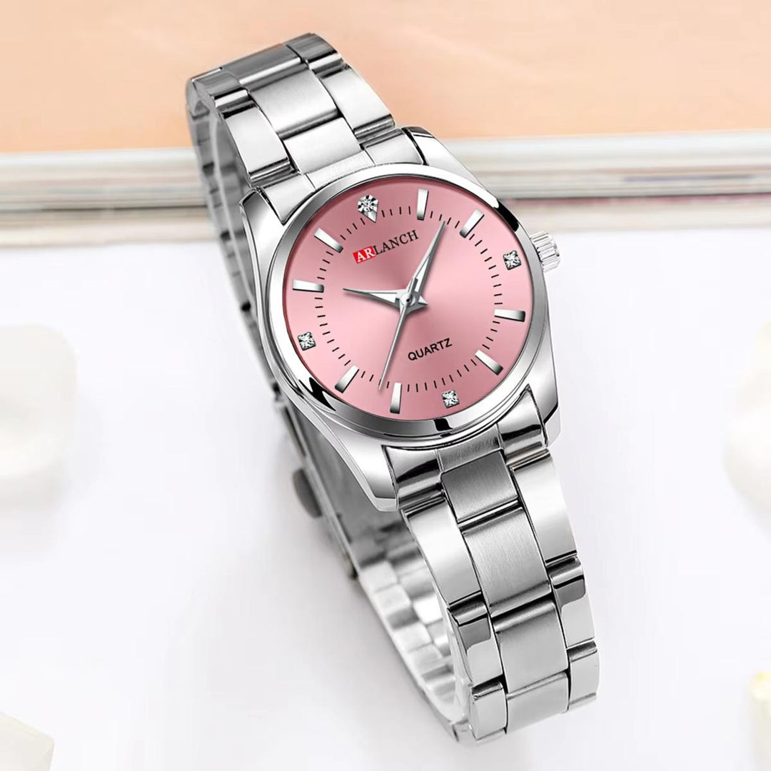 Close-up of 29mm ladies pink dial watch with sparkling rhinestone crystal bezel