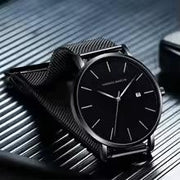 Side profile of Bauhaus minimalist men's watch with navy blue dial and slim stainless steel case